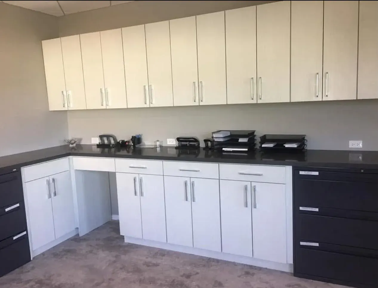 White and dark cabinets in an office kitchenette