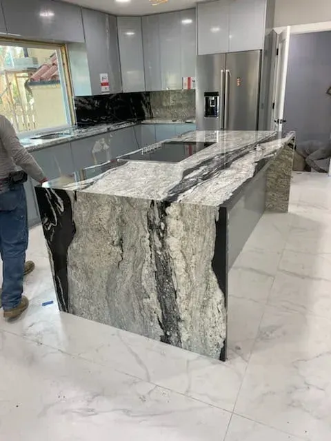 Kitchen island with a granite waterfall edge
