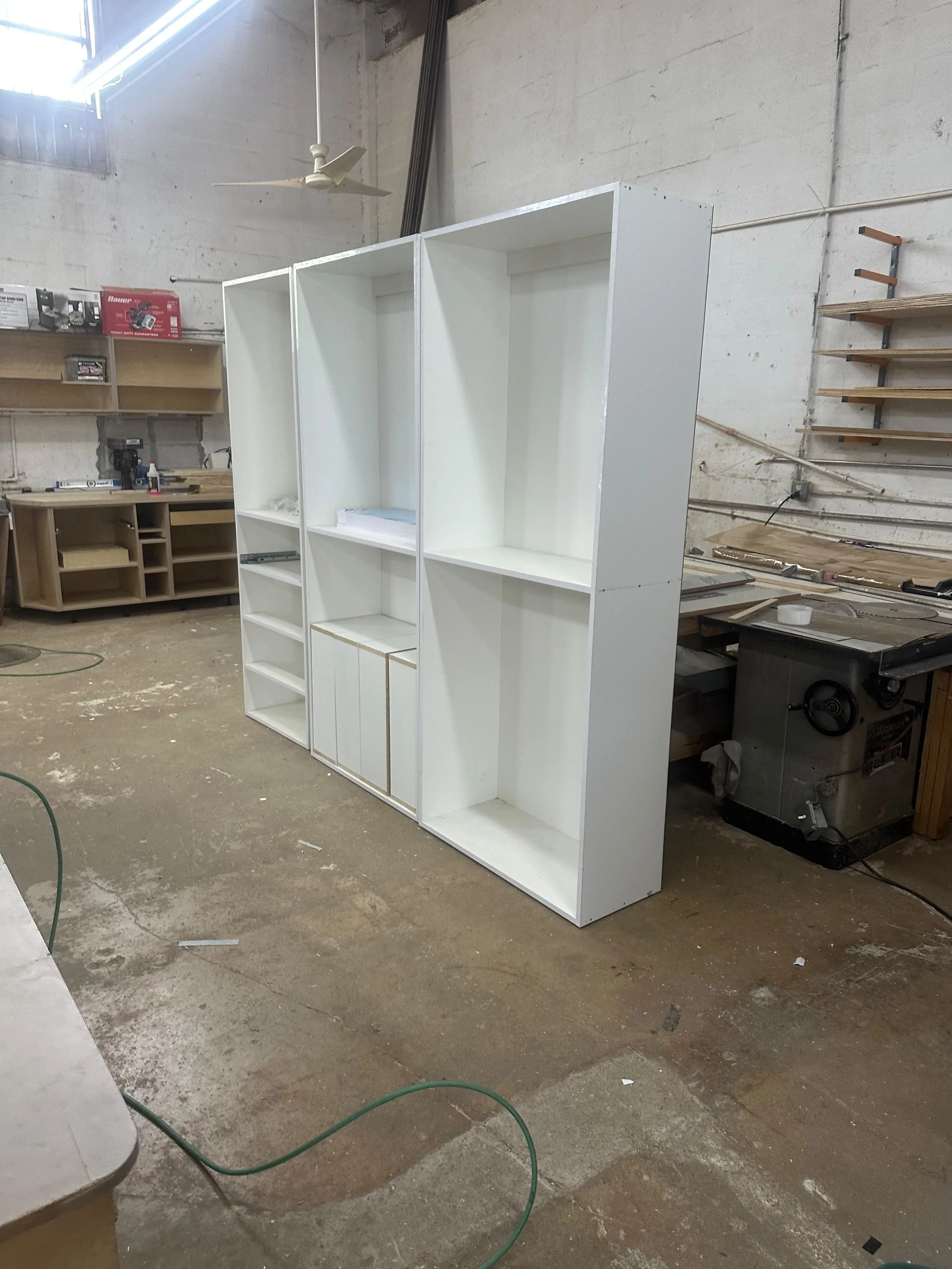 White shelving cabinet built in the workshop