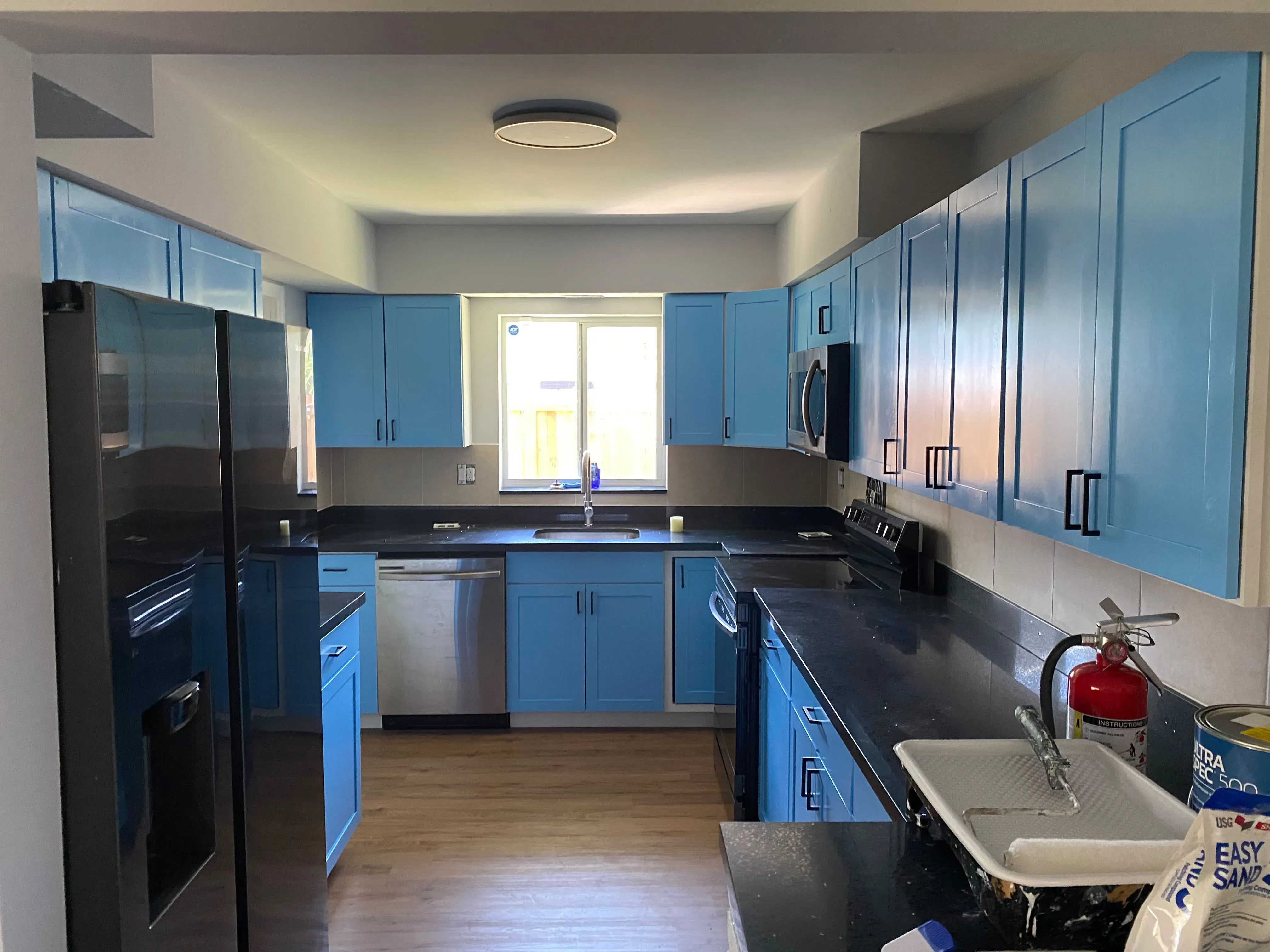 Blue shaker cabinets in a kitchen