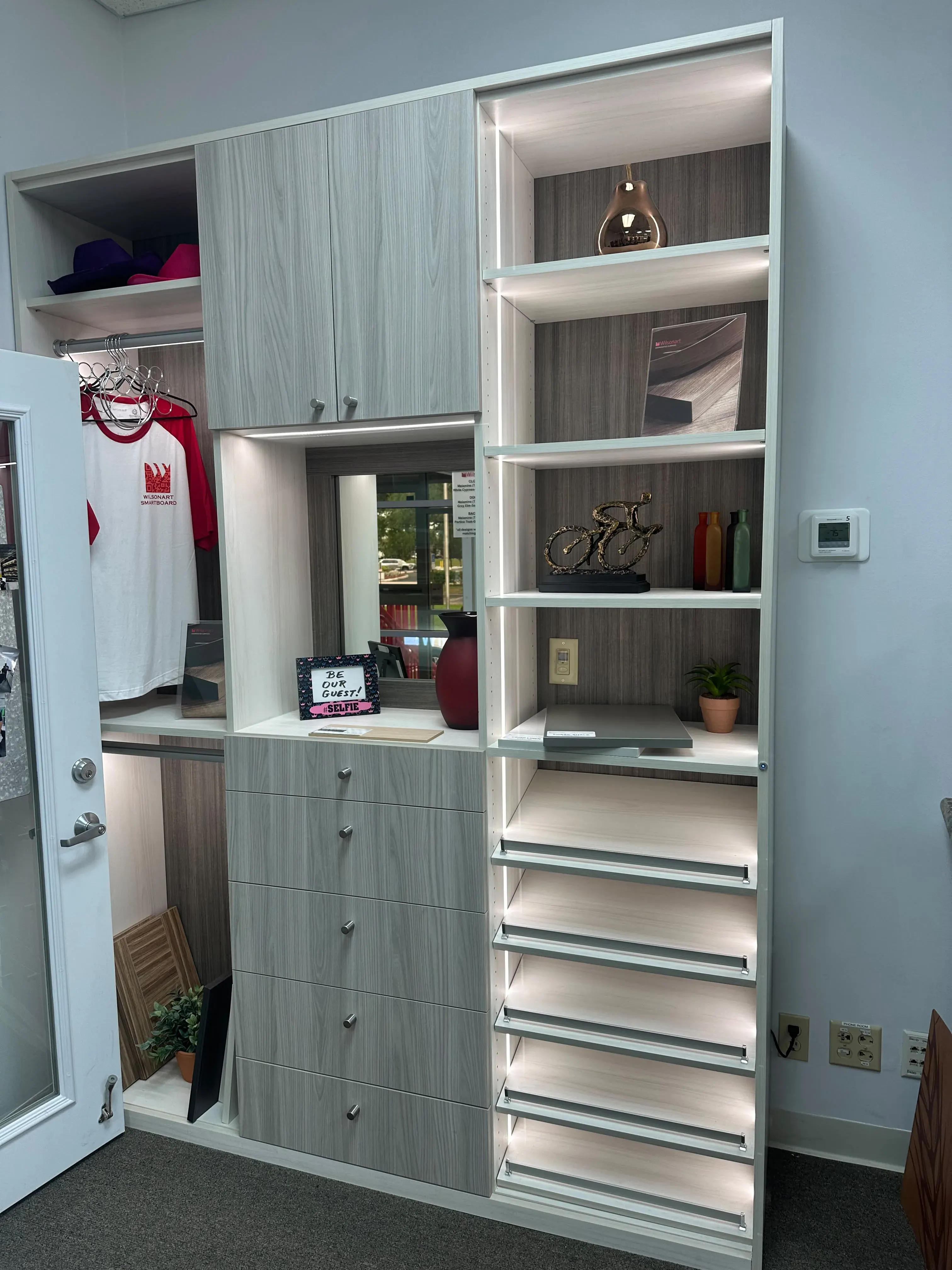 Custom closet cabinetry with drawers and shelves