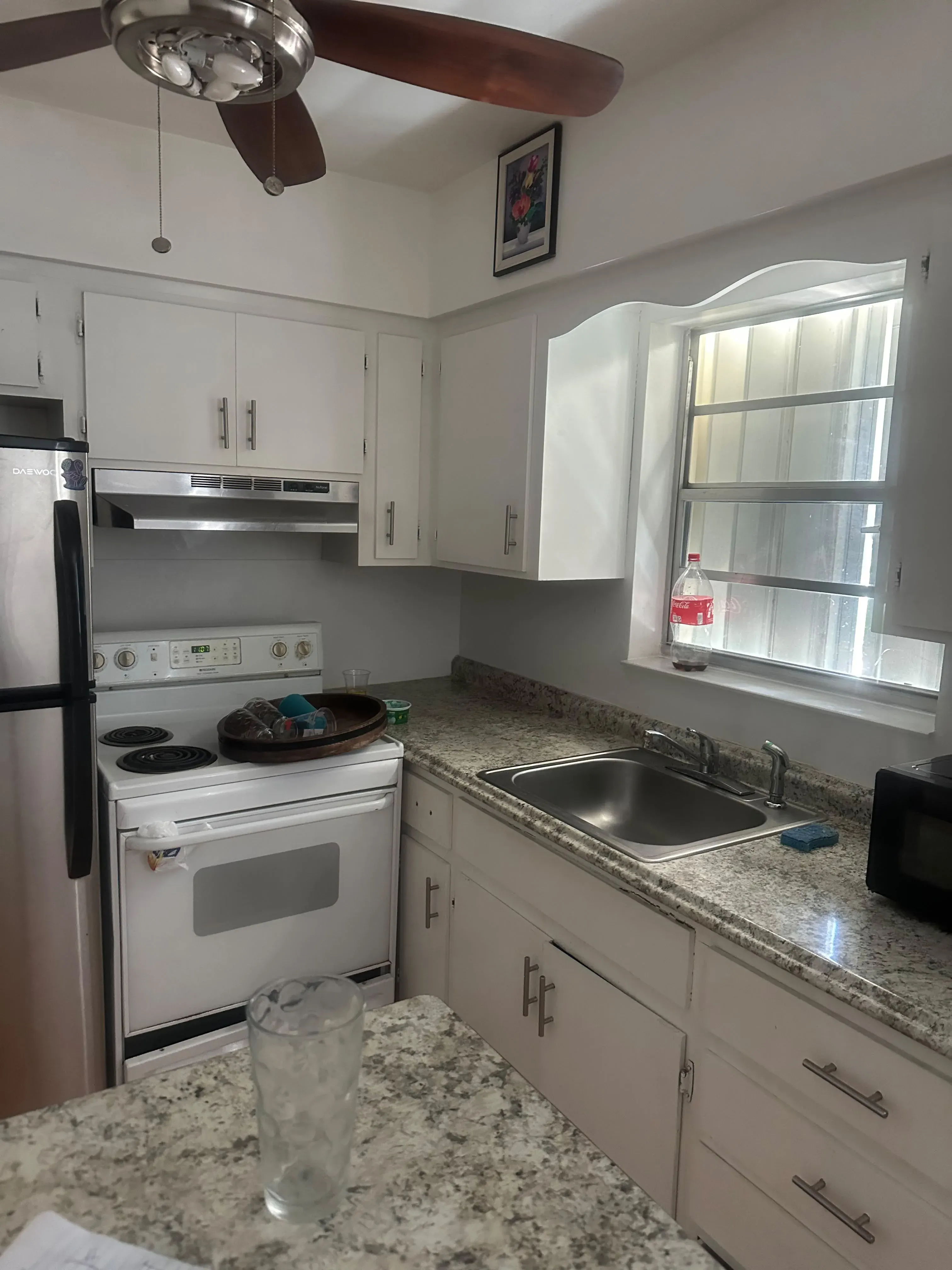 White cabinets with a granite countertop